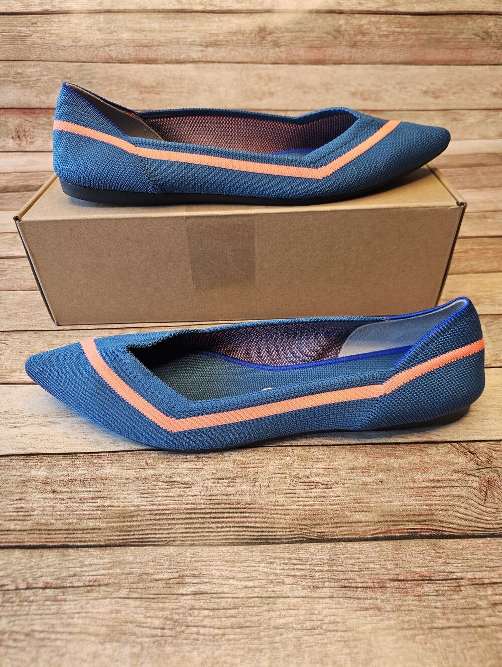 Rothy's The Point knit flats in teal blue with a contrasting coral orange stripe